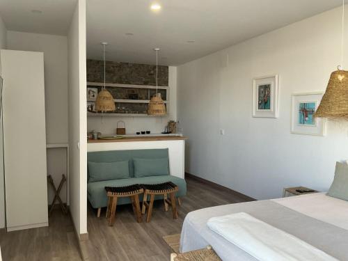 a bedroom with a bed and a table in a room at Casa Amarela_ Alojamento Local in Mértola