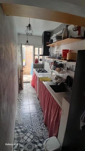 a kitchen with a long counter in a kitchen at Casa Bella Vizcaína in Mineral de Pozos