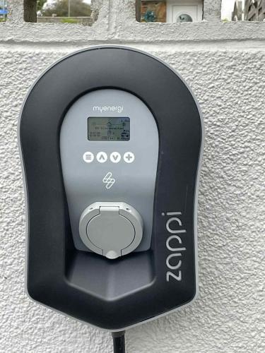 a parking meter on the side of a building at Pen Mar Guest House in Tenby