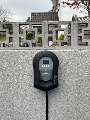 a black object is attached to a wall at Pen Mar Guest House in Tenby
