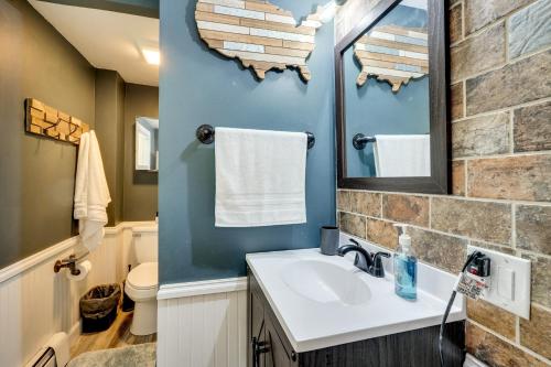 a bathroom with a sink and a mirror at Little Woodland Home Hidden Gem By Dtwn Bethlehem in Bethlehem