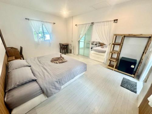 Ένα ή περισσότερα κρεβάτια σε δωμάτιο στο Vijit Bungalow