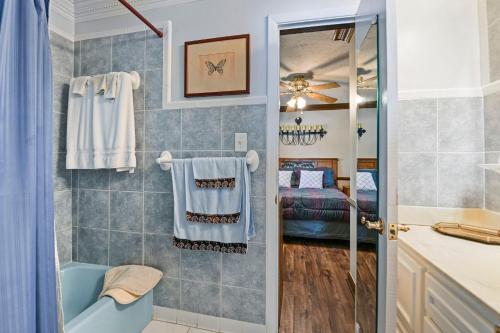a bathroom with a tub and a shower stall at The Jordan View in Titus