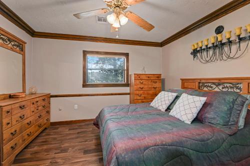 a bedroom with a bed and a ceiling fan at The Jordan View in Titus