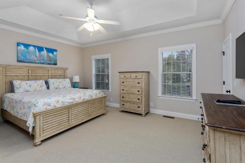 a bedroom with a bed and a dresser at 306 Reserve Lane in Jewtown