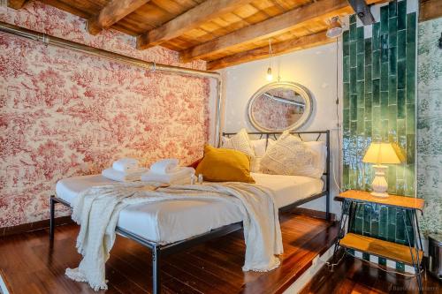 a bedroom with a bed with towels on it at LOFT near Bocconi and the Center in Milan