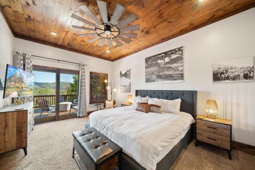 a bedroom with a large bed and a wooden ceiling at Cranberry View Lodge in Newland