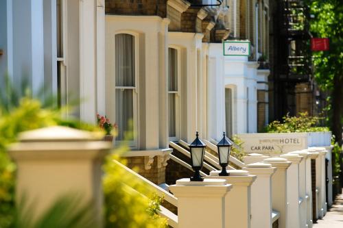 a row of white fences in front of a building at Albany, Brighton & Hove in Brighton & Hove