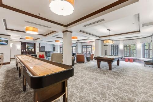 a large room with a pool table and ping pong balls at Vail Valley Retreat Shared Pool Hot Tub & Sauna in Avon