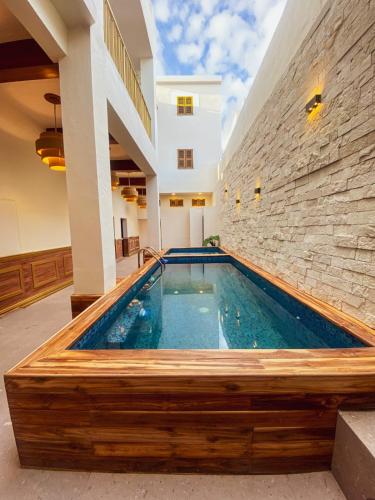 a swimming pool in the middle of a building at Hotel Boutique Lumiere in Tampico