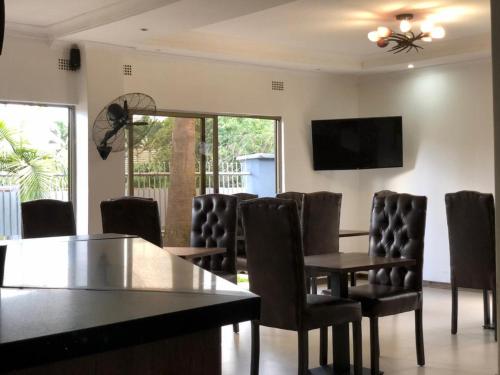 TV a/nebo společenská místnost v ubytování Rosewood Place Lodge