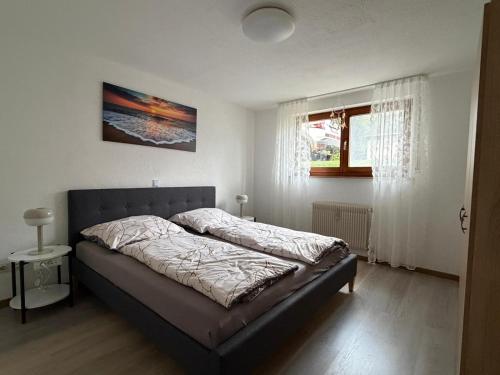 a bedroom with a bed and a window at Apartment HESS in Rust