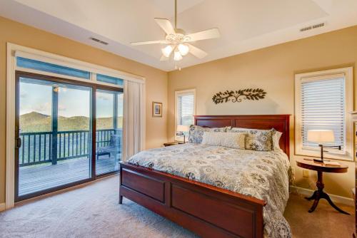 a bedroom with a bed and a balcony at Sugar Sky at The Reserve II in Sugar Mountain