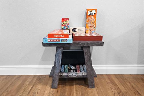 a table with boxes of food and snacks on it at Nr Museum Med Center Zoo Apt Fire Pit BBQ Games in Houston