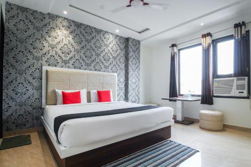 Postel nebo postele na pokoji v ubytování Hotel O Jalsa