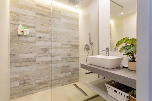 a bathroom with a sink and a glass shower at Apartment in Guardamar del Segura, Oasis Beach X in Guardamar del Segura