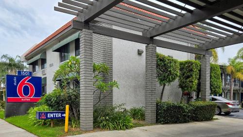 a gas station with a sign in front of it at Studio 6 Suites Santa Ana, CA in Santa Ana
