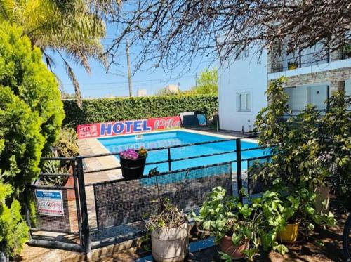 a house with a swimming pool in a yard at Hotel Pilar in Pilar