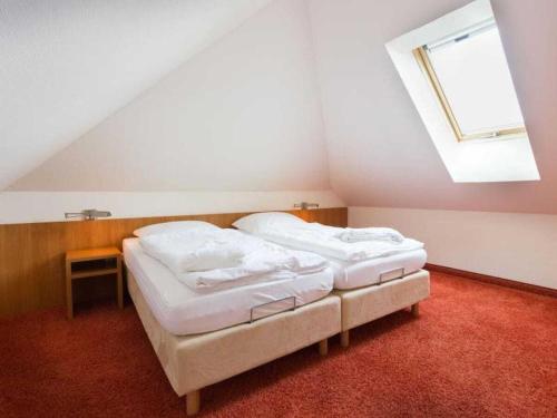 Ένα ή περισσότερα κρεβάτια σε δωμάτιο στο Pilsum - Greetsiel