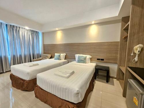 Postel nebo postele na pokoji v ubytování Avana Laem Chabang Boutique Hotel