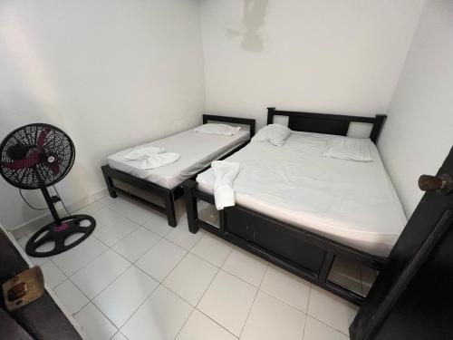 Apartamentos Coveñas TIIにあるベッド