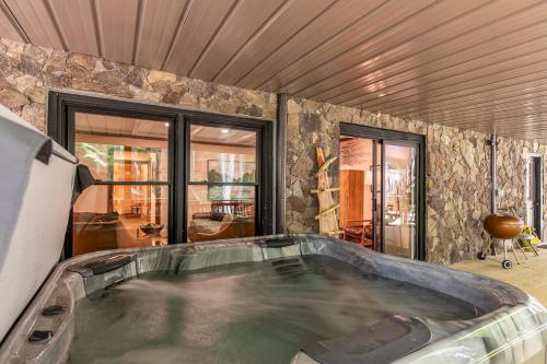 a jacuzzi tub in a living room with at Moosey Creek Lodge in Banner Elk