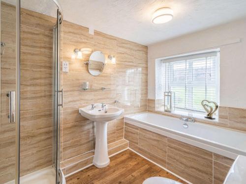 a bathroom with a sink and a toilet and a tub at 2 Bed in Bouth LCC02 in Bouth