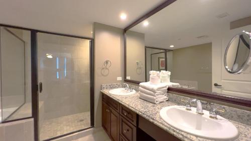 a bathroom with two sinks and a shower at Mar Vista Grande - 806 in Myrtle Beach