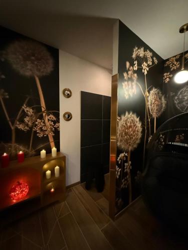 a bathroom with a shower and a fire place at Ecrin de Charme in Granville