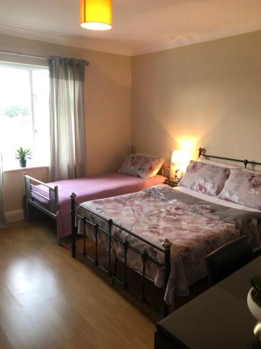 Postel nebo postele na pokoji v ubytování Sunset Room