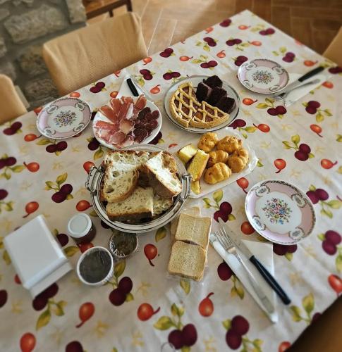 a table with a table cloth with food on it at Campo della Corte in Castelpagano