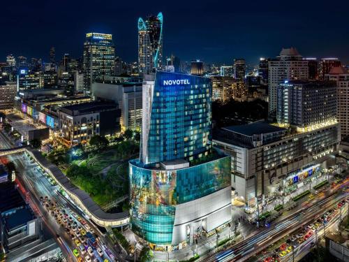 a view of a city at night with traffic at Novotel Bangkok Platinum Pratunam in Bangkok