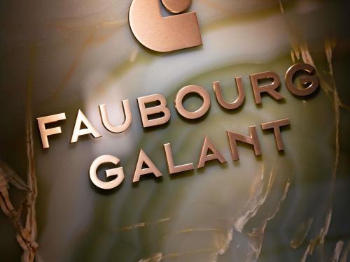 a wooden sign that readsgraduate calitzerland with a heart at Hotel Faubourg Galant Paris - Handwritten Collection in Paris