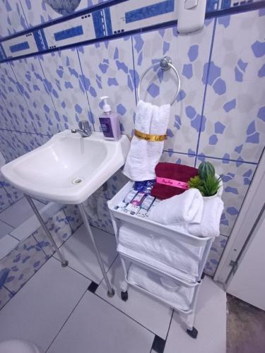 a bathroom with a sink and a towel rack at Apartment on the 1st Floor in Lima