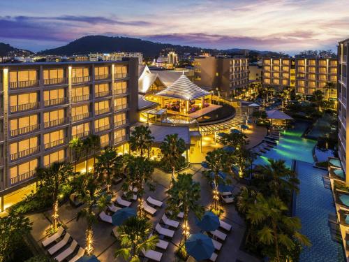 an aerial view of a city at night at Grand Mercure Phuket Patong in Patong Beach
