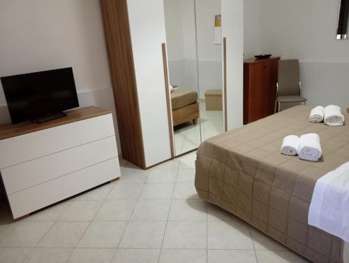 Postel nebo postele na pokoji v ubytování Red House- Accogliente appartamento vicino al porto