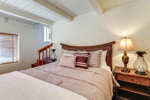 a bedroom with a bed and a lamp on a table at Route 66 Retreat Dog-Friendly Home in Williams in Williams