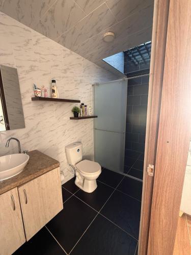 a bathroom with a toilet and a sink at Finca Formentera Relax in San Javier