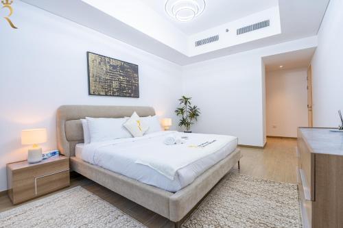 Ένα ή περισσότερα κρεβάτια σε δωμάτιο στο Maison d'Or The waterfront Haven 2BR Mayan