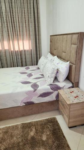a bedroom with a bed and a window at Bright Modern Apartment in Oualidia