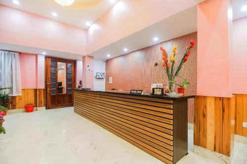 a lobby of a hotel with a reception desk at Hotel O Jwajalapa Homestay in Kalimpong