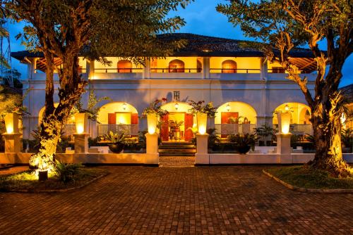 an exterior view of a building at night at Tamarind Hill Galle in Galle