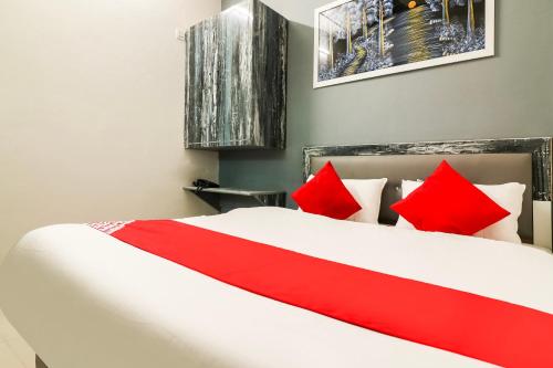 Postel nebo postele na pokoji v ubytování Hotel O Sheela