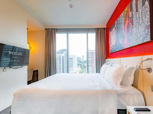 Postel nebo postele na pokoji v ubytování Mercure Singapore Bugis