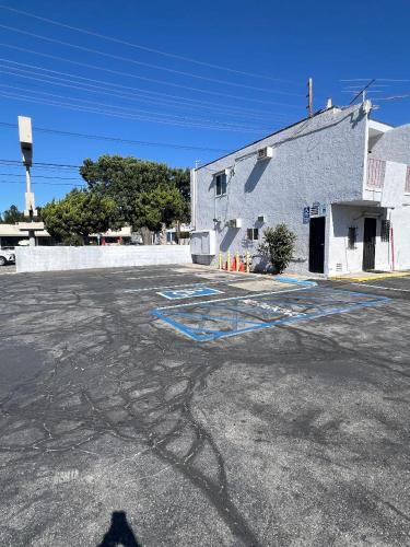 a shadow of a building in a parking lot at York Motel in Los Angeles