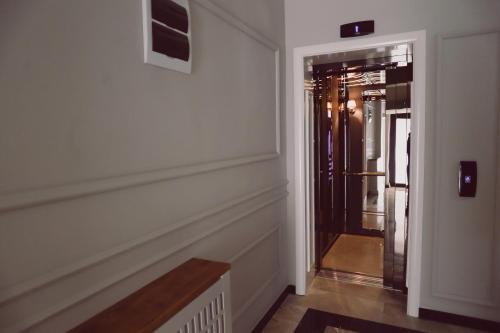 a hallway with a door leading into a room at C&C Residence Hotel in Bacău