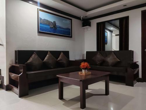 Χώρος καθιστικού στο Jace's Travellers Inn