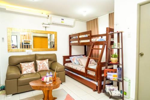 a living room with bunk beds and a couch at Serene City Abode in Santa Rosa