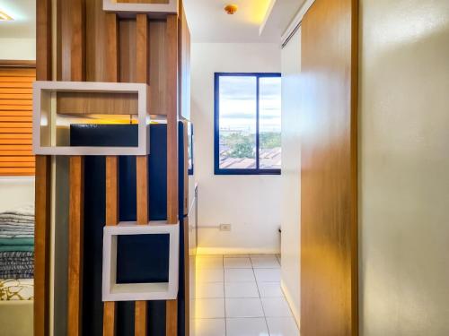 a small room with a window and a staircase at Serene City Abode in Santa Rosa