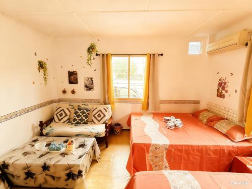 Ένα ή περισσότερα κρεβάτια σε δωμάτιο στο 玖月舒苑